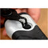 Close-up of snap ring pliers engaging a snap ring on a tool component