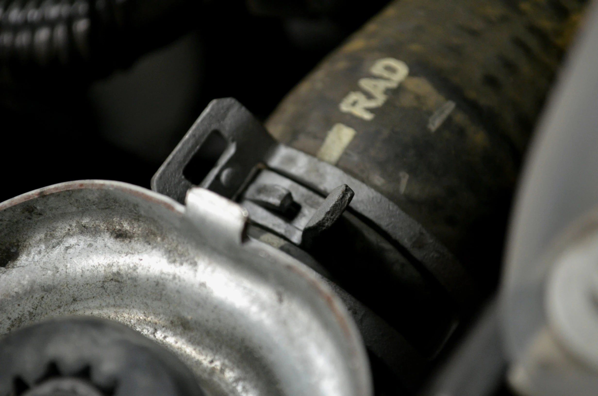Detail view of self-tightening hose clamp secured on radiator hose