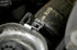 Detail view of self-tightening hose clamp secured on radiator hose