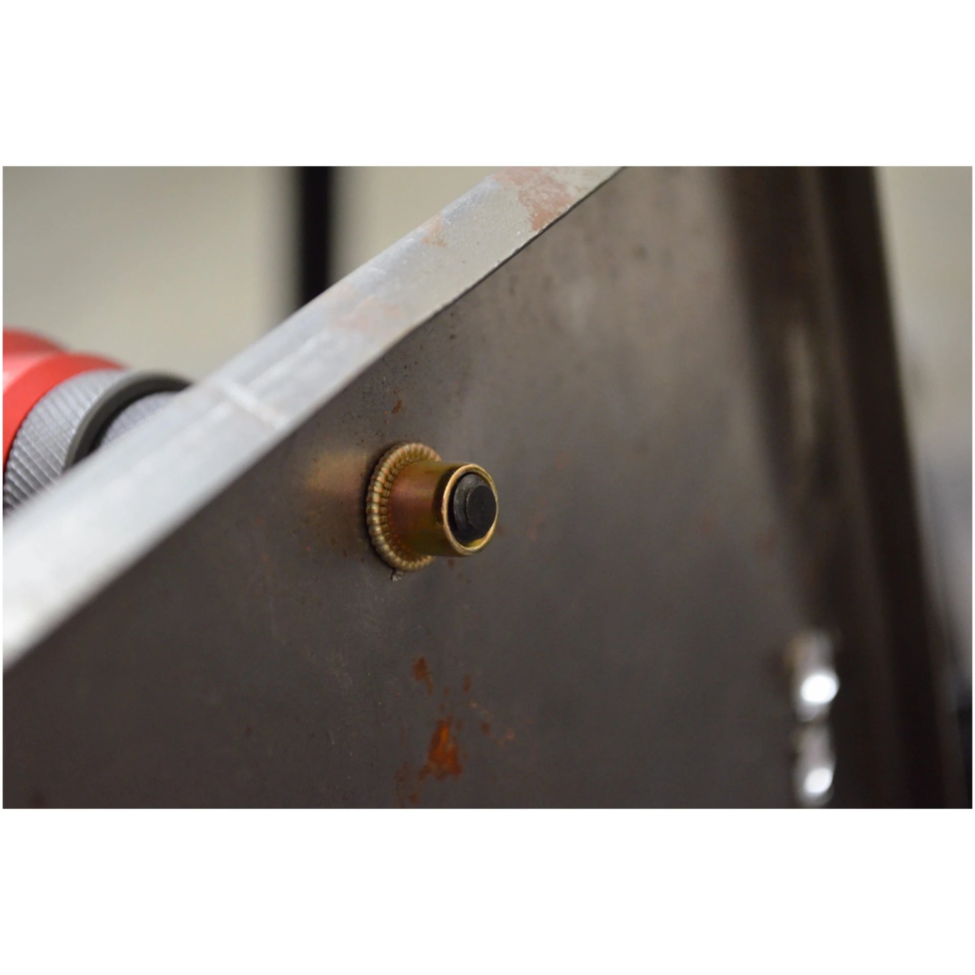 Close-up of a rivet nut installed flush in a metal panel using the Astro Pneumatic ADN14