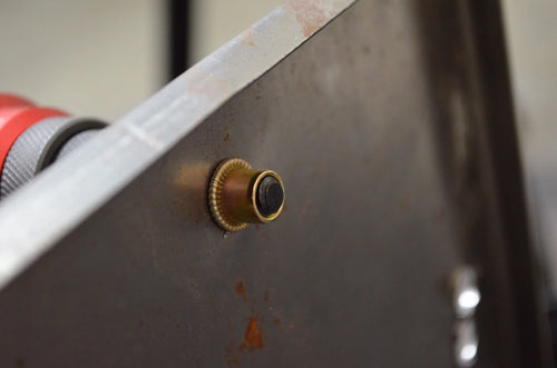 Rivet nut being set into metal panel using the Astro Pneumatic ADN14 drill adapter