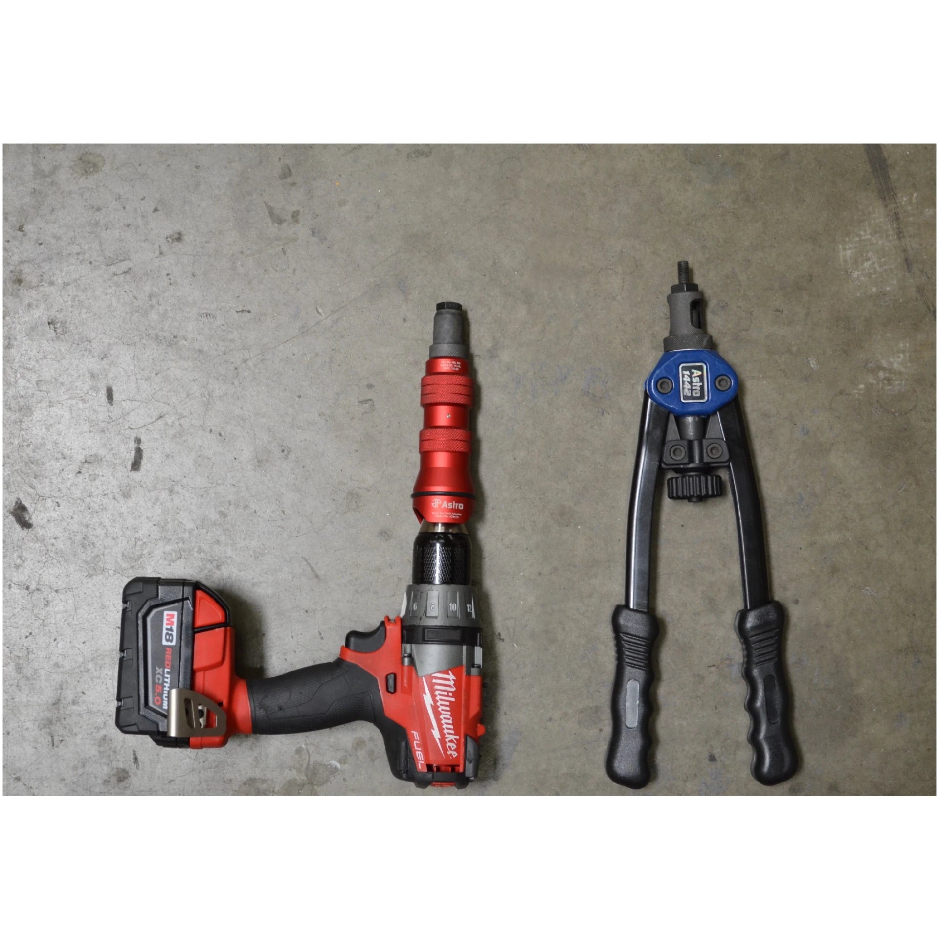 Astro Pneumatic ADN38 XL Rivet Nut Drill Adapter Kit shown mounted in cordless drill alongside rivet tool for scale