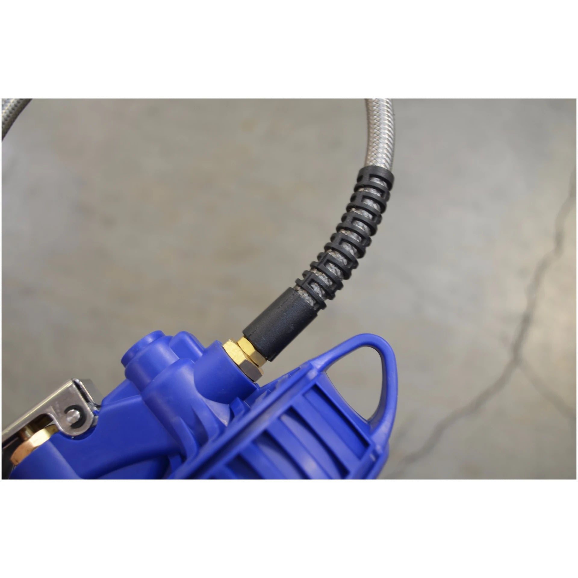 Astro Pneumatic AST-3018 digital tire inflator stainless braided hose entry and brass fitting detail