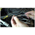 Astro Pneumatic 94404 spark plug socket lifestyle shot holding spark plug on engine