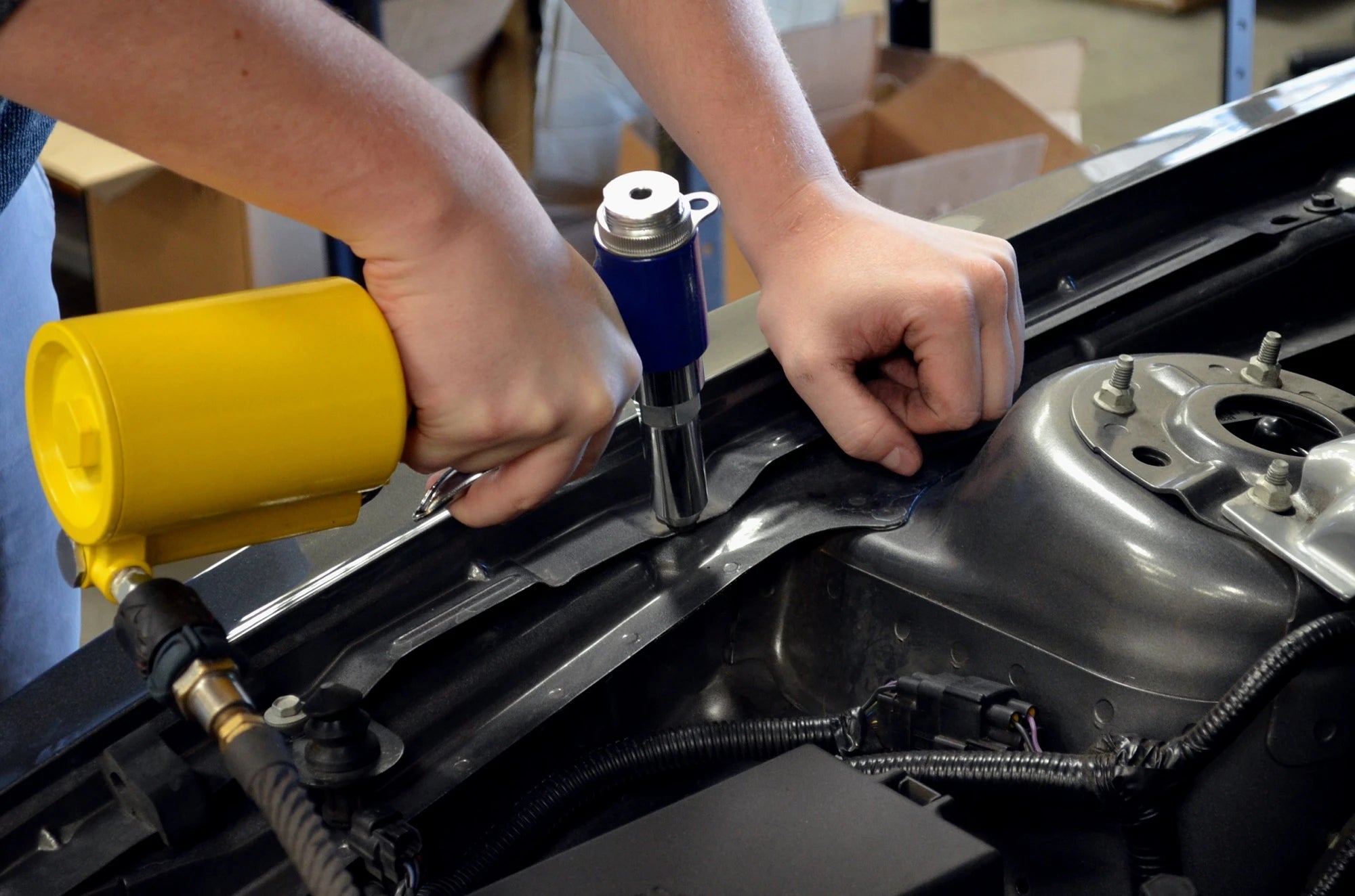 Astro Pneumatic PR36 Air Riveter in use riveting automotive frame panel